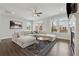 Bright living room with fireplace, recessed lighting, and modern sectional at 3440 Hardy St, Duluth, GA 30096