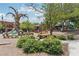 Outdoor playground featuring a whimsical tree sculpture, shaded seating, and modern play structures at 3440 Hardy St, Duluth, GA 30096