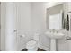 Chic powder room with a pedestal sink, modern fixtures, and a clean, minimalist design at 3440 Hardy St, Duluth, GA 30096