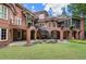 Expansive backyard with brick patio, outdoor entertaining space, and lush green lawn at 4634 Whitestone Way, Suwanee, GA 30024
