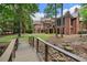 Picturesque backyard view with charming bridge leading to the main house at 4634 Whitestone Way, Suwanee, GA 30024