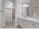 Bathroom featuring a vanity with plenty of storage, a large mirror and a separate shower area at 4634 Whitestone Way, Suwanee, GA 30024