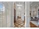 Grand foyer with tile flooring, arched doorways, and white columns opening into a luxurious living space at 4634 Whitestone Way, Suwanee, GA 30024