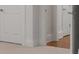 Hallway with trim along baseboards and carpeted floor at 4634 Whitestone Way, Suwanee, GA 30024