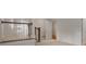 Upstairs hallway with wood and white railing, leading to other rooms with carpeted floors at 4634 Whitestone Way, Suwanee, GA 30024