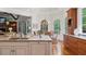 Gourmet kitchen features an island with granite counters and a breakfast nook for casual dining experiences at 4634 Whitestone Way, Suwanee, GA 30024