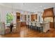 The gourmet kitchen offers a spacious island with bar seating and overlooks the breakfast area and backyard at 4634 Whitestone Way, Suwanee, GA 30024