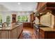 Gourmet kitchen featuring a large island, custom cabinetry, stainless steel appliances, and natural light at 4634 Whitestone Way, Suwanee, GA 30024