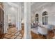 Elegant living room featuring hardwood floors, white columns, and large windows with natural light at 4634 Whitestone Way, Suwanee, GA 30024