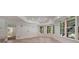 Living room showcasing decorative molding and lots of natural light at 4634 Whitestone Way, Suwanee, GA 30024