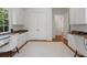 Spacious office with hardwood floors, custom cabinets, and matching granite countertops at 4634 Whitestone Way, Suwanee, GA 30024