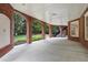 Covered brick patio with arched columns, offering ample space for outdoor living and entertaining at 4634 Whitestone Way, Suwanee, GA 30024