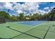 Well-maintained tennis court with professional lighting and a covered rest area at 4634 Whitestone Way, Suwanee, GA 30024