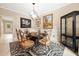 Elegant dining room with decorative chairs, marble table, and a contemporary light fixture at 4771 Summerwood Se Dr, Smyrna, GA 30126