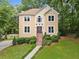 Charming two-story home featuring a landscaped yard and welcoming entrance, nestled in a lush, wooded area at 4771 Summerwood Se Dr, Smyrna, GA 30126