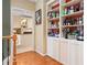 Hallway with built-in shelving and an open view into the bright, modern kitchen at 4771 Summerwood Se Dr, Smyrna, GA 30126