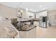 Well-lit kitchen featuring granite counters, white cabinetry, stainless appliances, and a breakfast bar with seating at 4771 Summerwood Se Dr, Smyrna, GA 30126