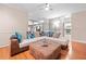 Cozy living room features comfortable seating, a ceiling fan, and hardwood floors, with a view into the kitchen at 4771 Summerwood Se Dr, Smyrna, GA 30126