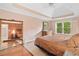 Spacious main bedroom featuring a tray ceiling, natural light, and a well-appointed ensuite bathroom at 4771 Summerwood Se Dr, Smyrna, GA 30126