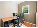 Inviting home office featuring natural light from the window, with a desk and computer at 4771 Summerwood Se Dr, Smyrna, GA 30126