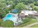 Aerial view of a community clubhouse featuring a pool, tennis court and parking at 58 Monet Nw Ct, Atlanta, GA 30327