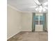 Serene bedroom with a ceiling fan and a view of the lush outdoors, promising relaxation at 58 Monet Nw Ct, Atlanta, GA 30327