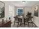 Charming dining area with a round table, comfortable chairs, and a window view at 58 Monet Nw Ct, Atlanta, GA 30327