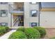 Attractive building exterior featuring well-kept landscaping and easy stairway access at 58 Monet Nw Ct, Atlanta, GA 30327