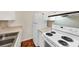 Well-equipped kitchen featuring white appliances and cabinets, great for everyday cooking at 58 Monet Nw Ct, Atlanta, GA 30327
