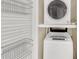 Laundry area featuring a stacked washer and dryer for efficiency at 58 Monet Nw Ct, Atlanta, GA 30327