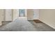Spacious living room with neutral carpeting and abundant natural light at 58 Monet Nw Ct, Atlanta, GA 30327