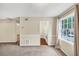 Open-concept living room, seamlessly connecting to the kitchen and other living areas at 58 Monet Nw Ct, Atlanta, GA 30327