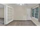 Inviting living room featuring an open doorway and large window, creating a spacious feel at 58 Monet Nw Ct, Atlanta, GA 30327