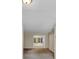 Living room view into other living spaces of the home, with connecting hallways and doorways at 58 Monet Nw Ct, Atlanta, GA 30327