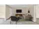 Cozy living room featuring a plush sofa, stylish decor, and a large TV at 58 Monet Nw Ct, Atlanta, GA 30327