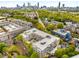 A high up aerial view of the condos with the city skyline in the background at 870 Inman Village Ne Pkwy # 305, Atlanta, GA 30307
