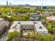 A long shot of the condos with the city skyline in the far background at 870 Inman Village Ne Pkwy # 305, Atlanta, GA 30307