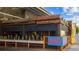 Exterior of rusted looking bar with a sign that says 'Ven Aqui' at 870 Inman Village Ne Pkwy # 305, Atlanta, GA 30307