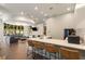 Community kitchen and lounge area with modern countertops, bar seating, and comfortable furniture at 870 Inman Village Ne Pkwy # 305, Atlanta, GA 30307