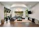 A relaxing lounge featuring a large L-shaped couch, decorative accents, and expansive windows at 870 Inman Village Ne Pkwy # 305, Atlanta, GA 30307