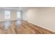 Large basement area featuring laminate floors, neutral paint, and natural light at 1172 Oakhurst Trl, Lawrenceville, GA 30043