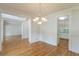 Elegant dining room with decorative trim, hardwood floors, and open floor plan at 1172 Oakhurst Trl, Lawrenceville, GA 30043