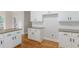 Kitchen area with white cabinets, granite counters and stainless appliances at 1172 Oakhurst Trl, Lawrenceville, GA 30043