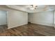 Spacious living room features wood floors, coffered ceilings, and ample space for entertaining at 1172 Oakhurst Trl, Lawrenceville, GA 30043