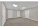 Finished basement with carpet, neutral walls, recessed lights and multiple entry doors at 130 Holly Reserve Pkwy, Canton, GA 30114