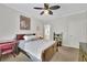 Well-lit bedroom with ceiling fan, neutral walls, wood furniture and Star Wars themed décor at 130 Holly Reserve Pkwy, Canton, GA 30114