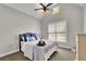 Cozy bedroom with a ceiling fan, window views, and comfortable decor. Perfect for relaxation at 130 Holly Reserve Pkwy, Canton, GA 30114