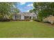 Inviting home featuring a lush green lawn, tasteful landscaping, and a charming facade with classic shutters at 130 Holly Reserve Pkwy, Canton, GA 30114