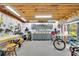 Spacious garage workshop with white pegboard walls, gray cabinets, and work tables at 130 Holly Reserve Pkwy, Canton, GA 30114