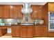 This gourmet kitchen features stainless steel appliances, granite countertops, and wood cabinets at 130 Holly Reserve Pkwy, Canton, GA 30114